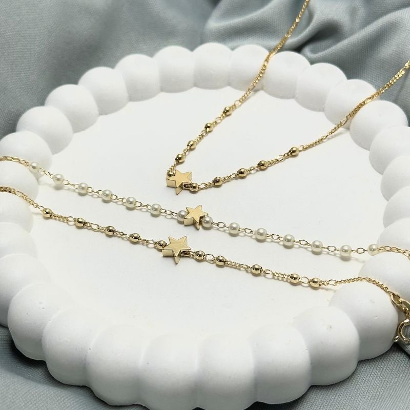 Pulseira 14+2cm Perolas C/ Estrela Lisa Passante